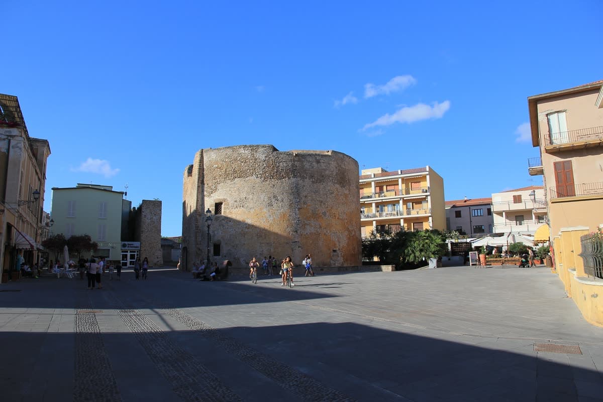 The round tower of San Giovanni in Alghero standing on an open square in the old town