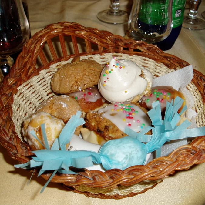 A basket of traditional Sardinian sweets: gueffus, amaretti, bianchini, papassinos and piricchittus