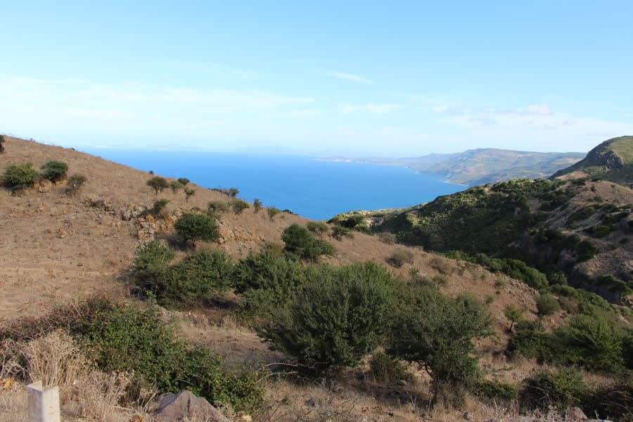 Maquis-covered hills falling to the sea along the coast between Alghero and Bosa.